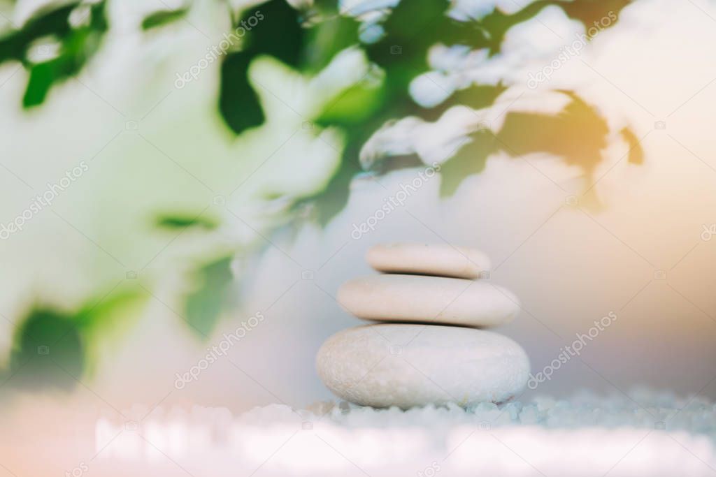 Spa still life with stacked of stones. Holiday, body care and luxury concept.