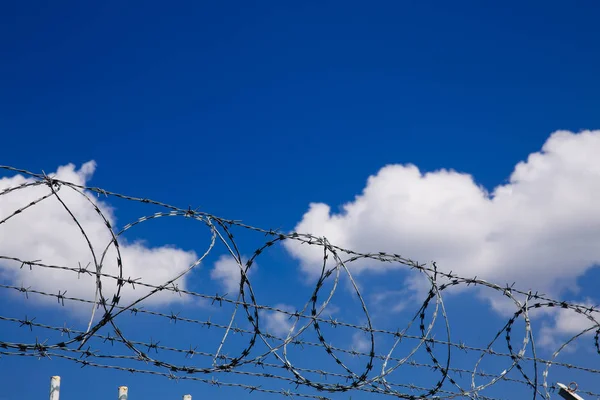 Stock image Barbed wire fence. Immigration themed image. 