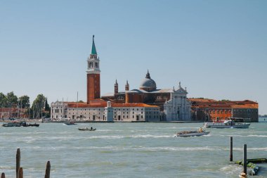 VENICE, ITALY -APRIL 8: Gondolas and tourists on April 8, 2019 in Venice, Italy. Venice has an average of 50,000 tourists a day.