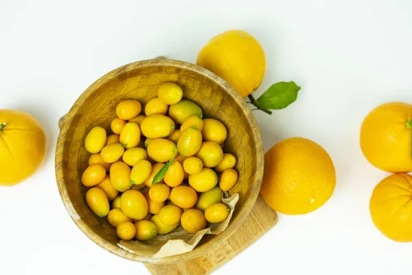 Orange on a wooden bowl. Fresh fruits, food on a white background. — Stock Photo, Image
