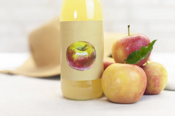 Apple cider vinegar on a table with red apples on a light background. Farm Organic Product Vinegar, Home-Made