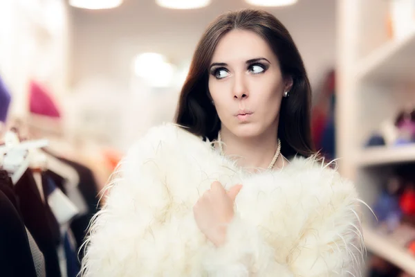 Curious Woman Wearing White Fur Coat in Fashion Store — Stockfoto