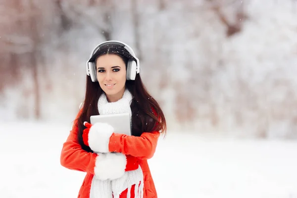 Happy Winter Girl with Headphones and PC Tablet — Stock Photo, Image