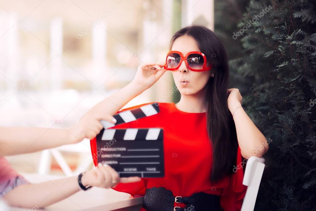 Surprised Actress with Oversized Sunglasses Shooting Movie Scene