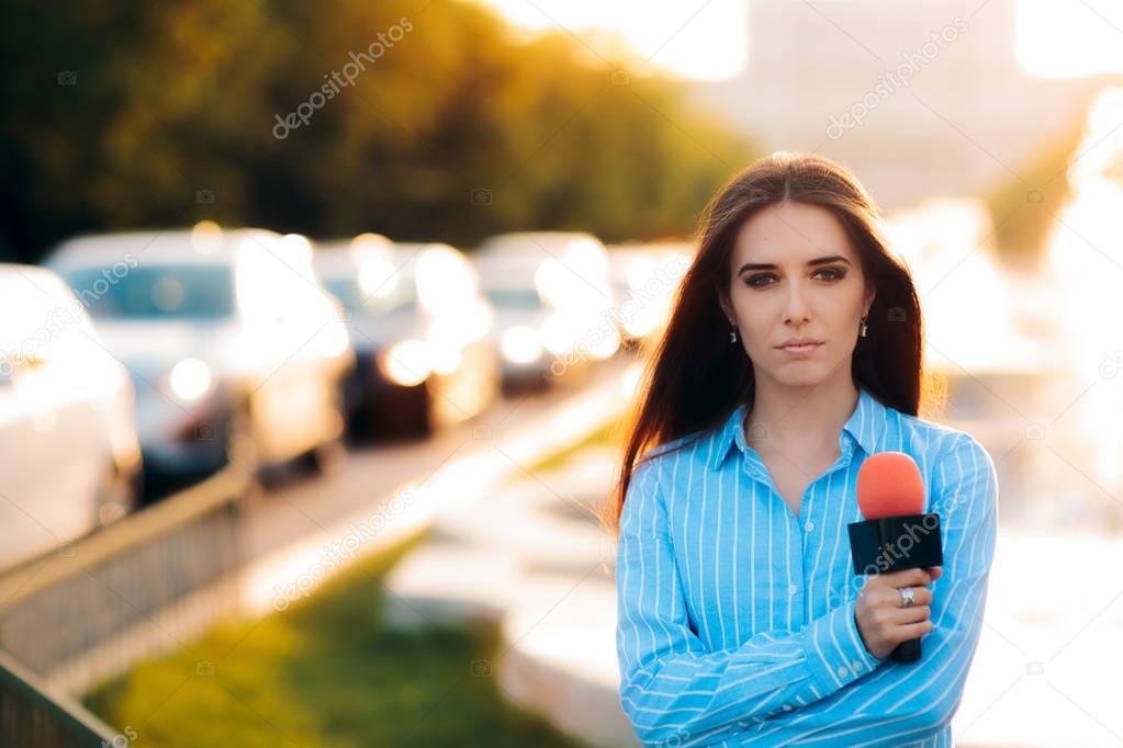 Female News Reporter on Field in Traffic 