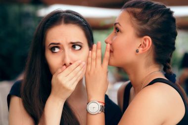 Gossiping Girl Telling Secrets to her Surprised Friend clipart