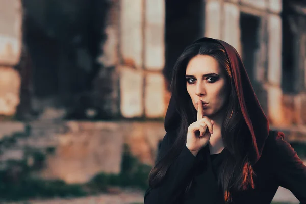Halloween Woman Keeping a Secret in front of a Ruins — стоковое фото