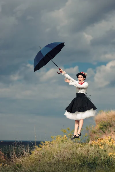 Fantezi portre havada şemsiye ile Retro kadın