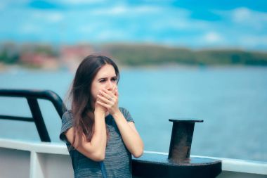 Sea sick woman suffering motion sickness while on boat clipart