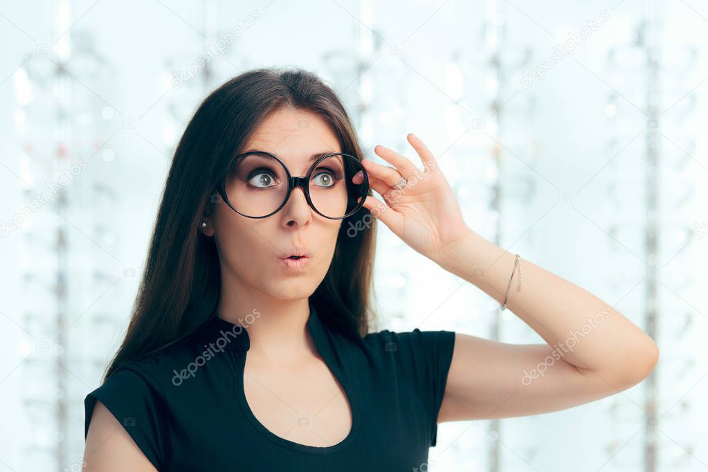 Funny Girl Looking for New Eyeglasses in Optical Store