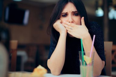 Nauseated Woman Feeling Sick at the Restaurant  clipart
