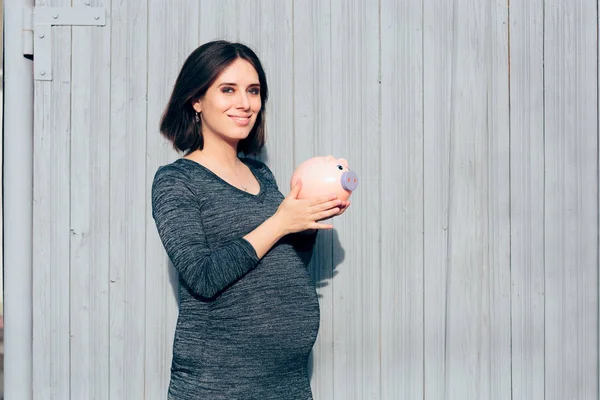 Happy Pregnant Woman Holding Piggy Bank — Stok Foto