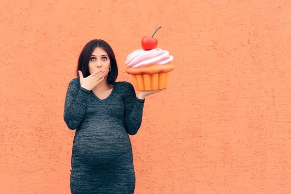 Pregnant Woman Craving Sweets Holding Huge Cupcake — Stock Photo, Image