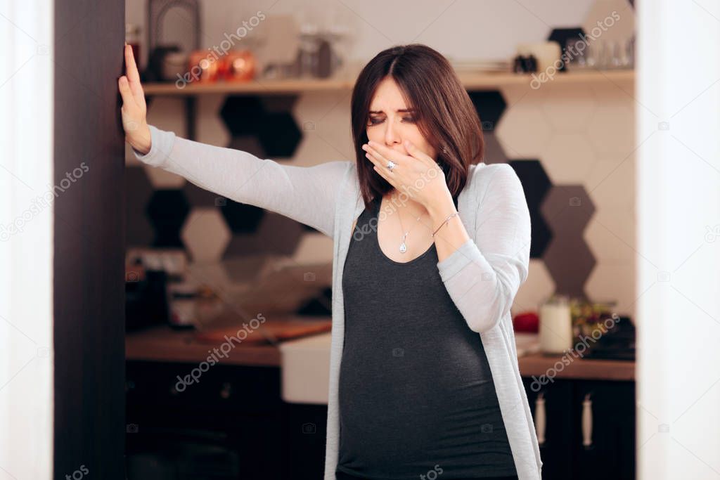 Pregnant Woman Feeling Sick in Her Kitchen 