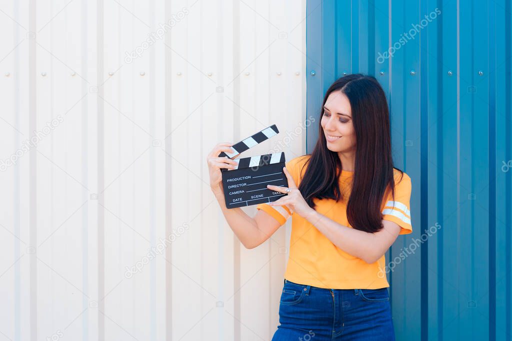 Aspiring Young Actress Holding Cinema Film Slate