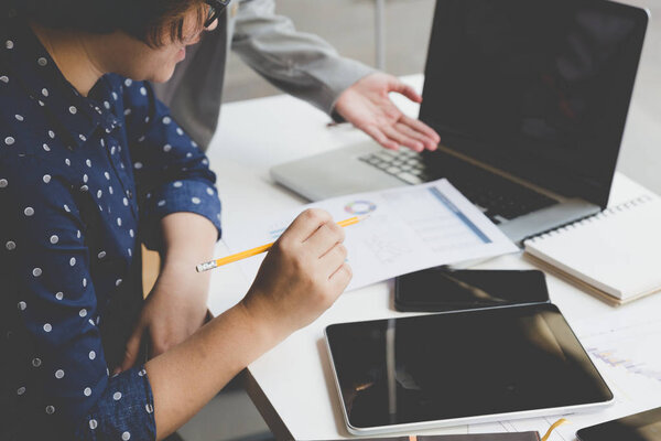 businesspeople working with document and computer in office work