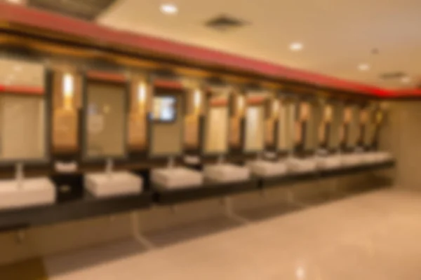 Blurred background of faucet and sink in public restroom toilet — Stock Photo, Image