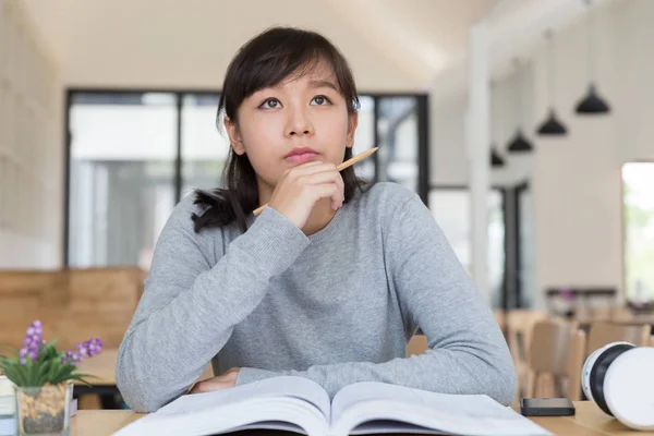 Asian girl female teenager studying at school. Student reading b — Stock Photo, Image