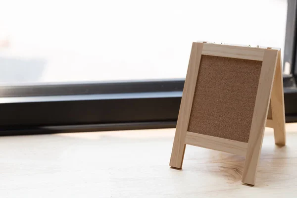 Corkboard on a wooden table. — Stock Photo, Image