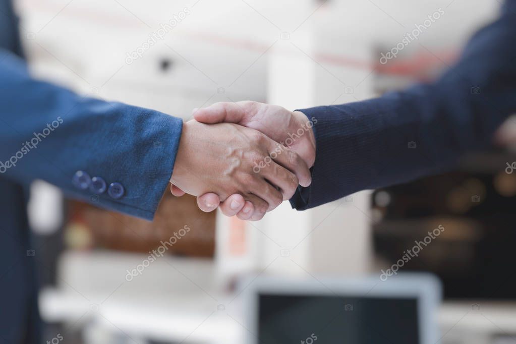 businessman handshaking after meeting in office - teamwork, coop