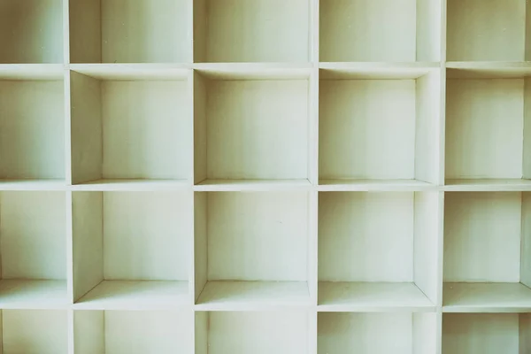 Empty white bookshelf, wall cabinet with wood floor — Stock Photo, Image