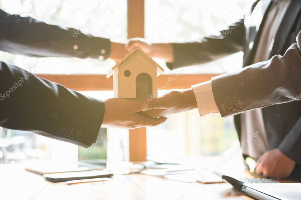 House developer and businessman shaking hands after finishing up