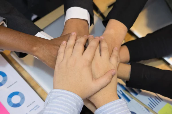 young businessman joining hand, team of business people touching