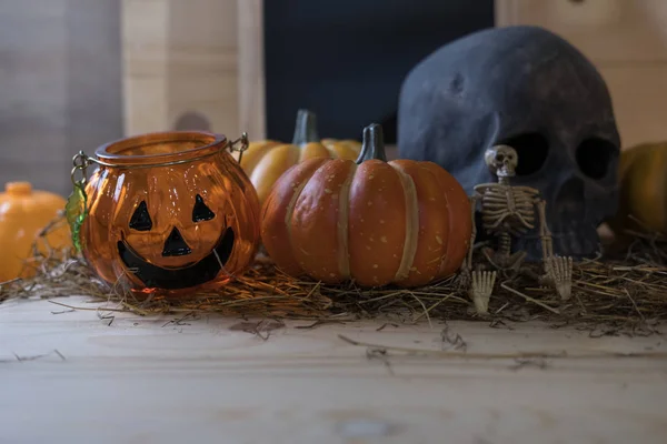 Pumpkin, skull, skeleton on wooden background for Halloween holi — Stock Photo, Image