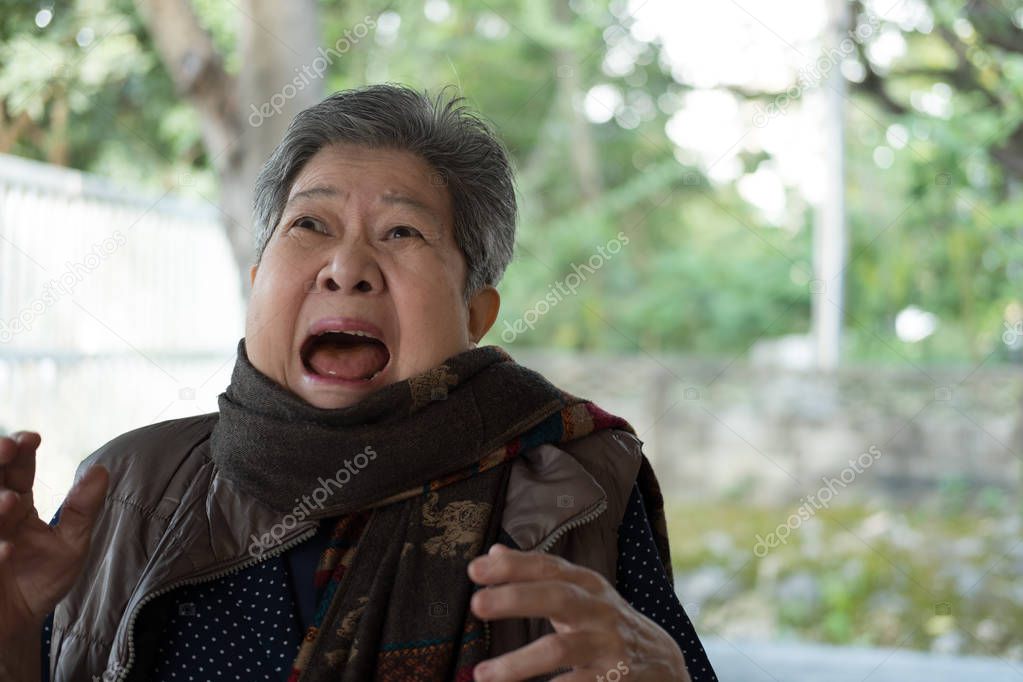 portrait of scared elder woman. frightened elderly female. surpr