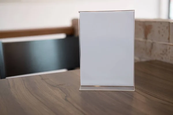 white label in cafe. display stand for acrylic tent card in coff