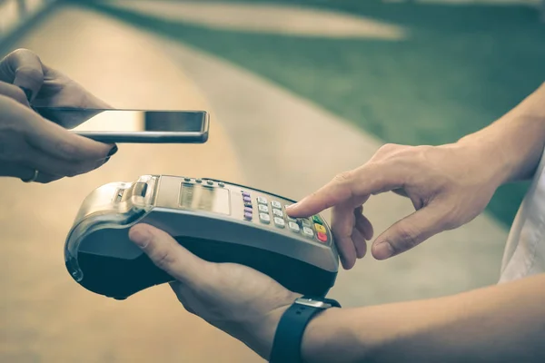 Woman use smartphone to make mobile payment with electronic read — Stock Photo, Image