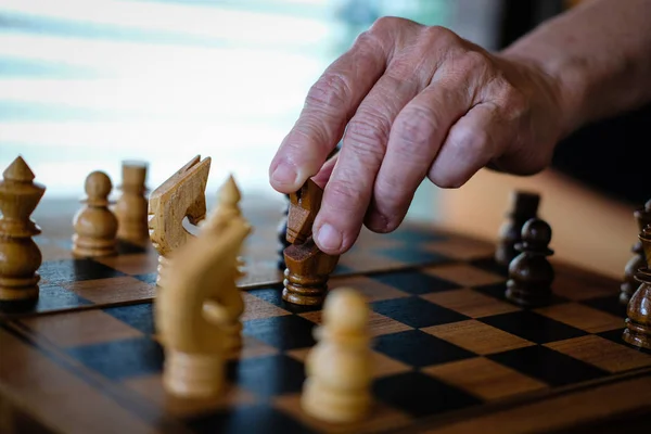 Hand playing chess game. business plan & analysis for success. r — Stock Photo, Image