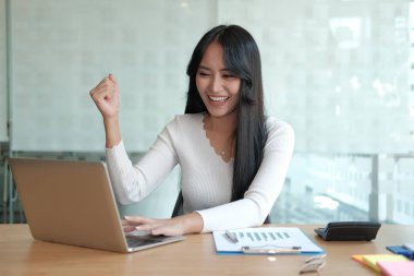 businesswoman feeling happy glad showing yes gesture at office. 