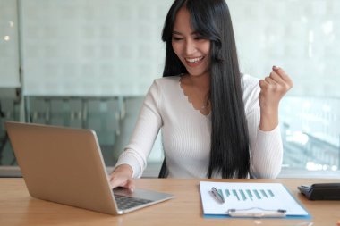 businesswoman feeling happy glad showing yes gesture at office. 