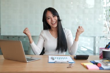 businesswoman feeling happy glad showing yes gesture at office. 