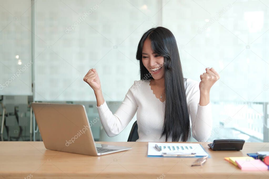 businesswoman feeling happy glad showing yes gesture at office. 
