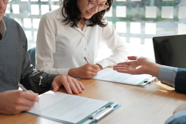 couple buying renting house car signing mortgage insurance purch