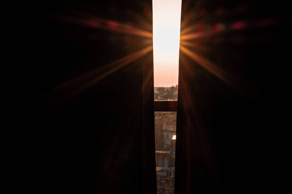 morning sunlight light ray through window curtain.