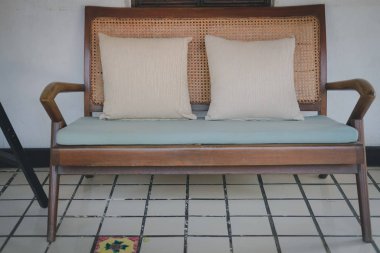 old vintage wicker rattan chair sofa couch on terrace balcony. l