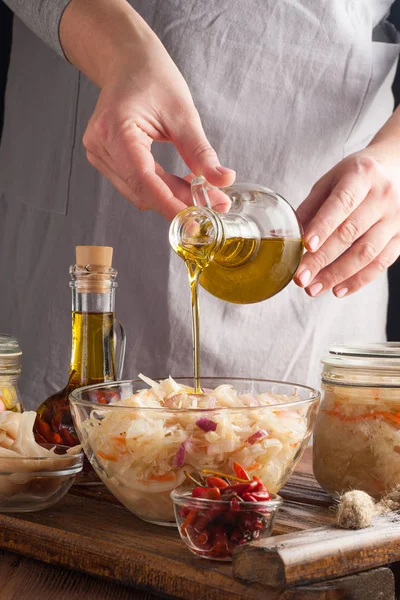 Woman makes homemade canned pickled and fermented vegetables for — 스톡 사진