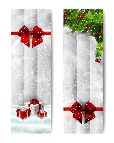 Two Christmas vertical banners. Red present in snow, green branches, and ribbon bow.