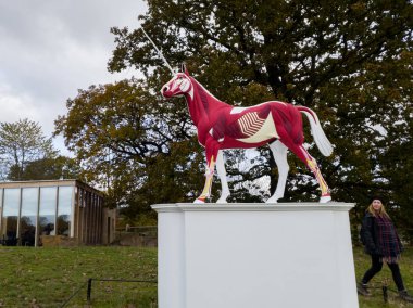 Wakefield, UK - 10th November 2019: Yorkshire Sculpture Park with Damien Hirsts The Myth sculpture in the background clipart