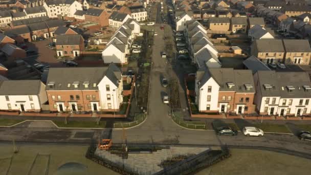 Aerial footage flying down the street of new homes built on the Waverley residential estate in Rotherham, South Yorkshire — Stock Video