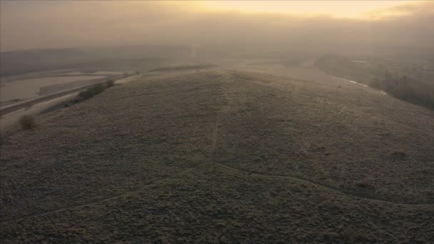 Beautiful golden aerial pan over Waverley Lakes during a cold frosty winters morning with people taking a morning walk around the lake — Stock Video