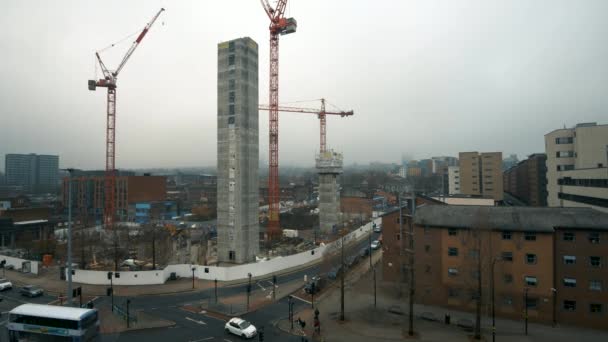 Sheffield, UK - 30th November 2019: Cranes build new tall buildings in the middle of Sheffield as new investment money flows into the city — 图库视频影像