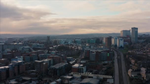 Sheffield, UK - 1st December 2019: Aerial view over Sheffield City, South Yorkshire, during a beautiful cold sunrise over the Christmas markets — Stock Video