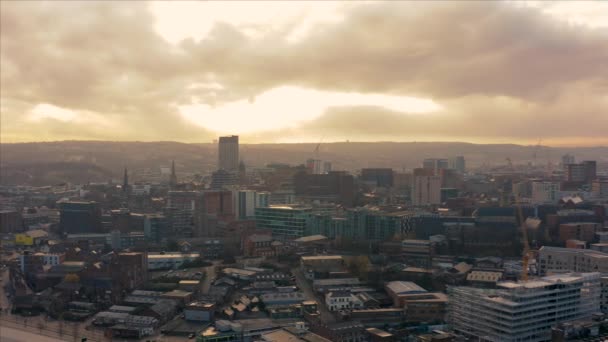 Sheffield, UK - 1st December 2019: Aerial fly over Sheffield City, South Yorkshire, UK during a beautiful golden winter sunrise — Stock Video