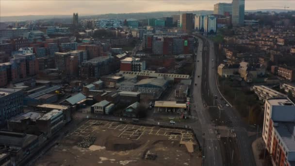 Sheffield, UK - 1st December 2019: Aerial sunrise reveal of Sheffield City during a frosty winters morning along a busy road — Stock Video
