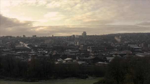 Sheffield, UK - 1st December 2019: Aerial fly over Sheffield City, South Yorkshire, UK during a beautiful golden winter sunrise — Stock Video