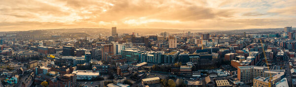 Sheffield, UK - 1st December 2019: Aerial Panoramic view above Sheffield City during frosty winter morning with golden sunrise